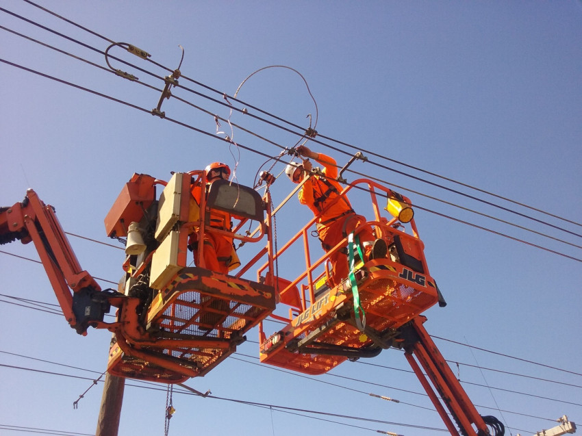 Traction staff working on overhead lines near Wellington station.