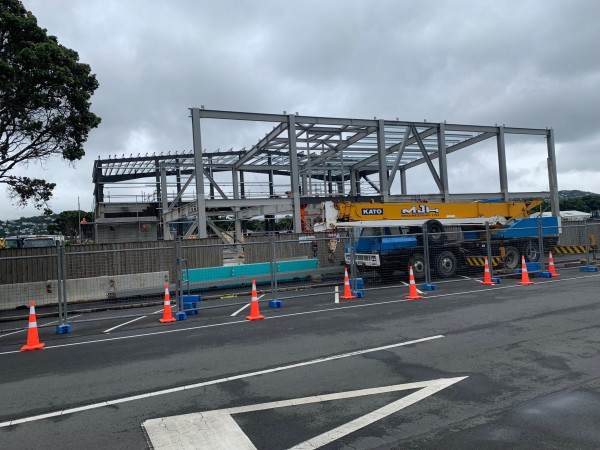 Crane parked on Kauri St for structural steel installation